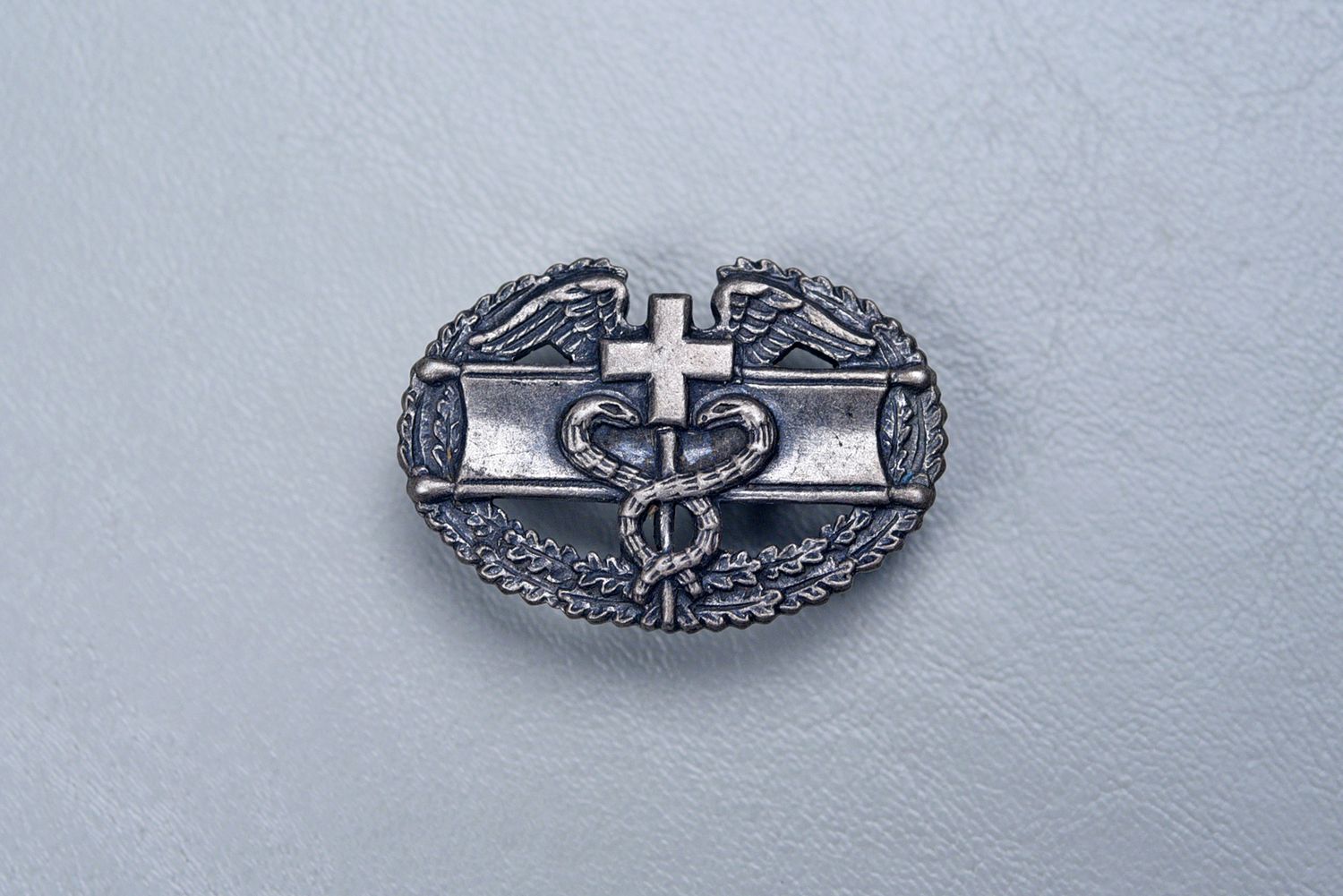 WWII U.S. COMBAT MEDIC w/CUT OUT SNAKES - PINBACK, STERLING