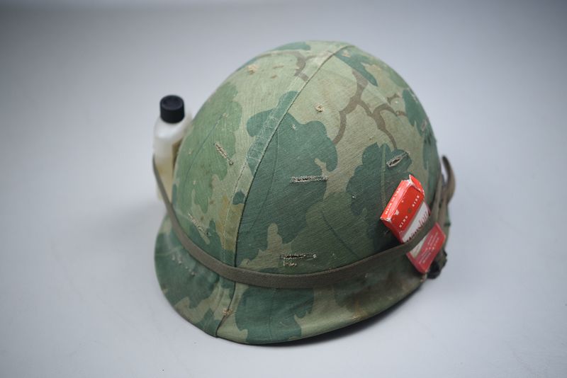 VIETNAM WAR U.S. M1 STEEL COMBAT HELMET w/TWILL MITCHELL CAMO COVER – DATED ‘65’ VIETNAM WAR U.S. M1 STEEL COMBAT HELMET w/TWILL MITCHELL CAMO COVER – DATED ‘65’