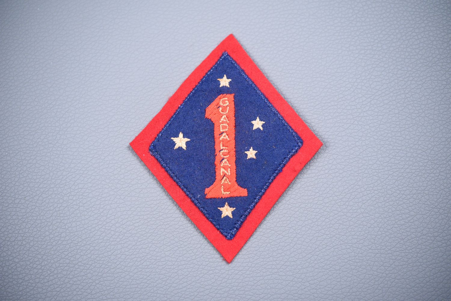 WWII U.S. MARINE CORPS 1st MAR. DIV. SHOULDER PATCH - AUSTRALIAN MADE, BLOODED WWII U.S. MARINE CORPS 1st MAR. DIV. SHOULDER PATCH - AUSTRALIAN MADE, BLOODED