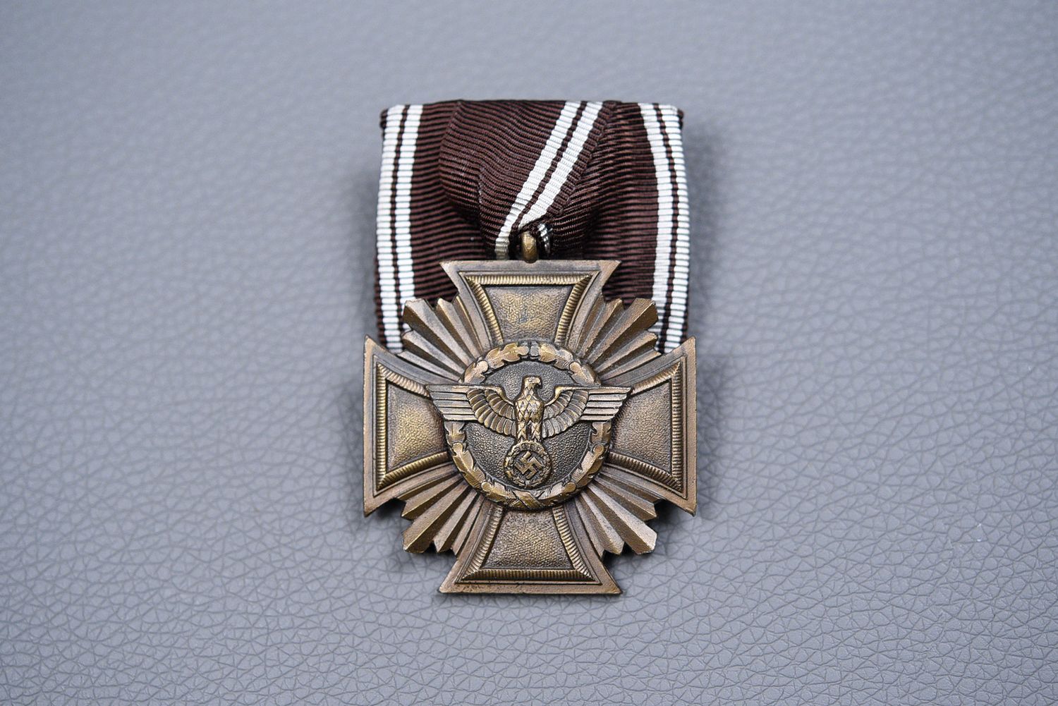 WWII GERMAN NSDAP 10-YEAR SERVICE MEDAL ON PARADE MOUNT – NEAR MINT WWII GERMAN NSDAP 10-YEAR SERVICE MEDAL ON PARADE MOUNT – NEAR MINT