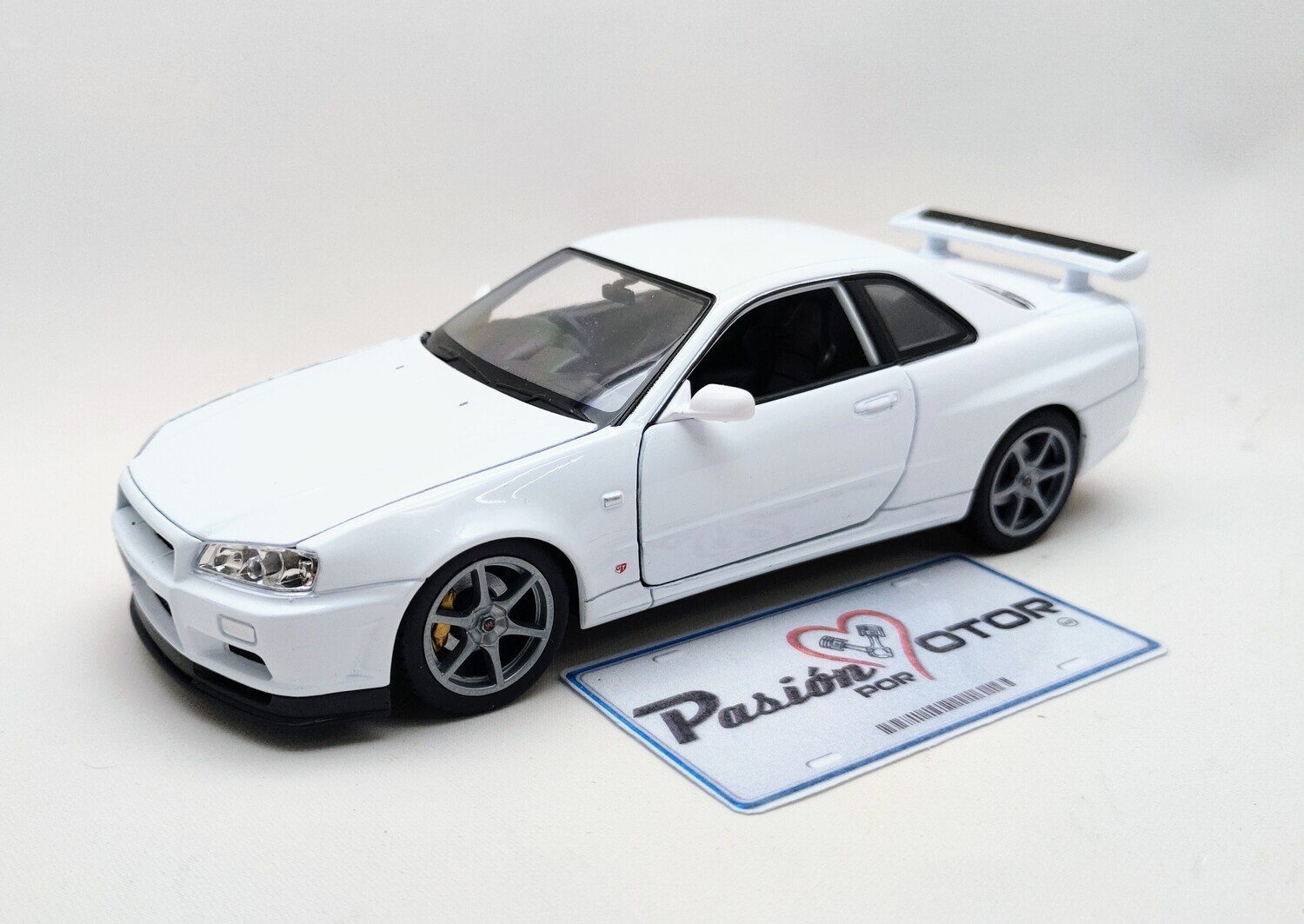 1:24 Nissan Skyline GT-R (R34) Coupe 1999 Blanco WELLY Nex Models