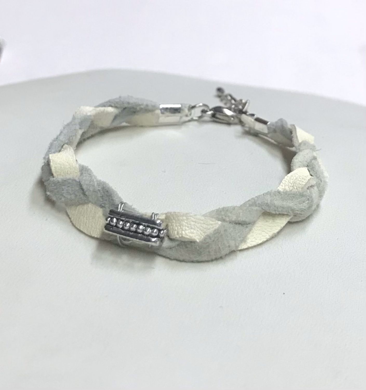 BRACELET TRESSÉ GRIS MÉTALLIQUE 