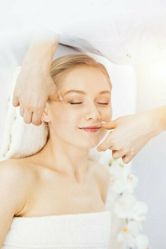 Epilation au fil -  lèvre