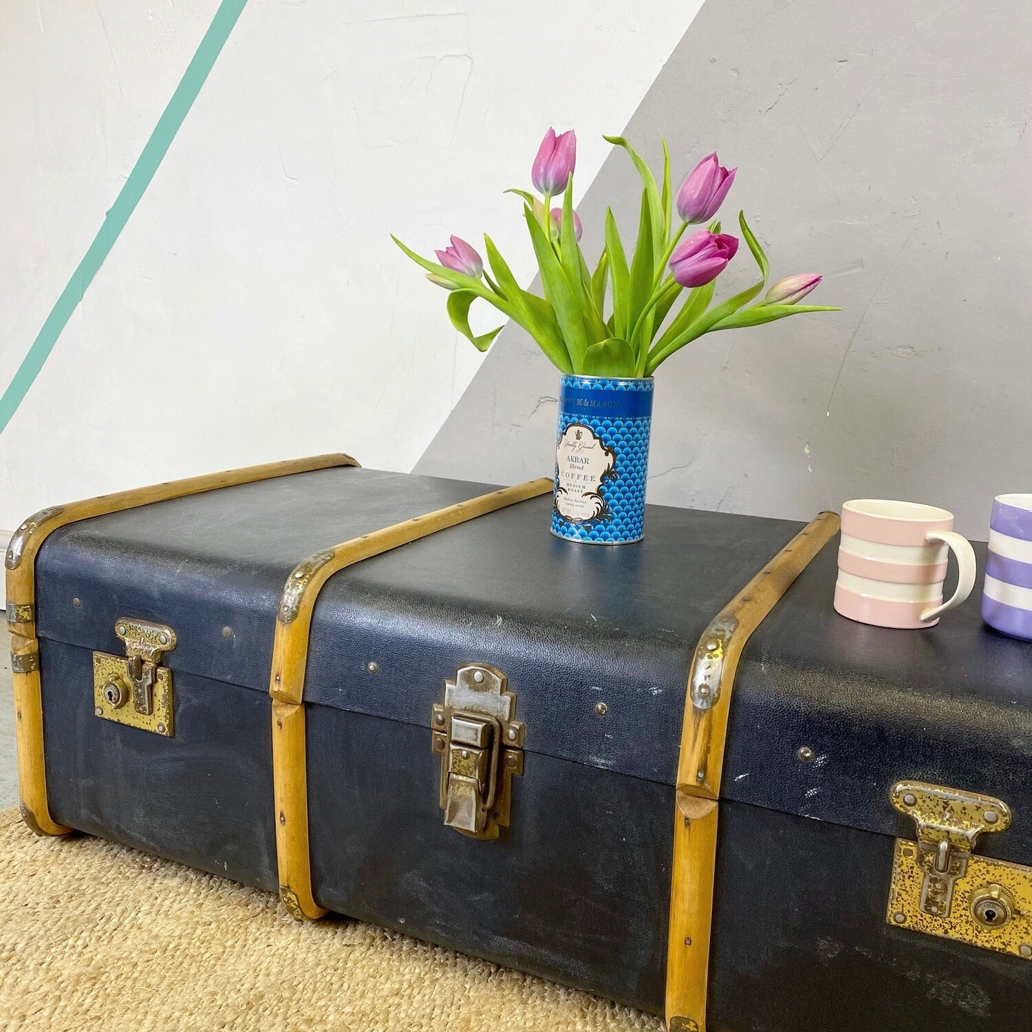 Vintage black steamer trunk coffee table