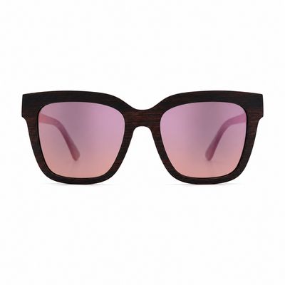 Front view of Stardust polarized cat-eye sunglasses with cherry pink lenses and handcrafted wood frame