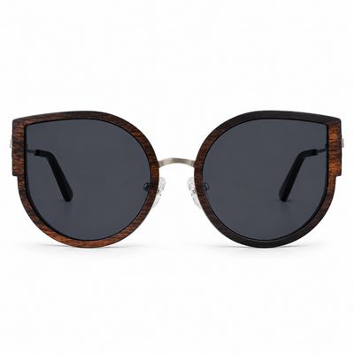 Cinder Heart cat-eye sunglasses angled front view with smoke polarized lenses and ebony wood accents