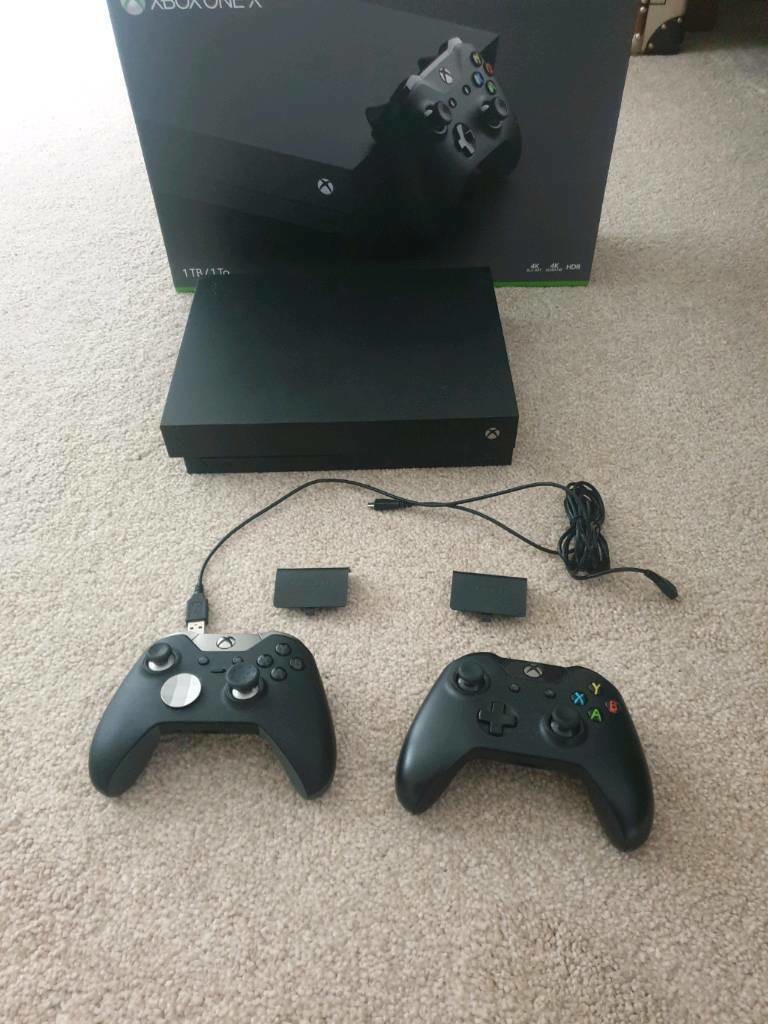 Xbox one X with 2 controllers