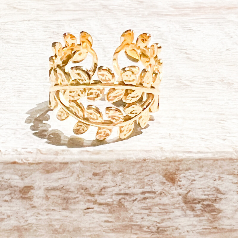 Anillo acero dorado hojas