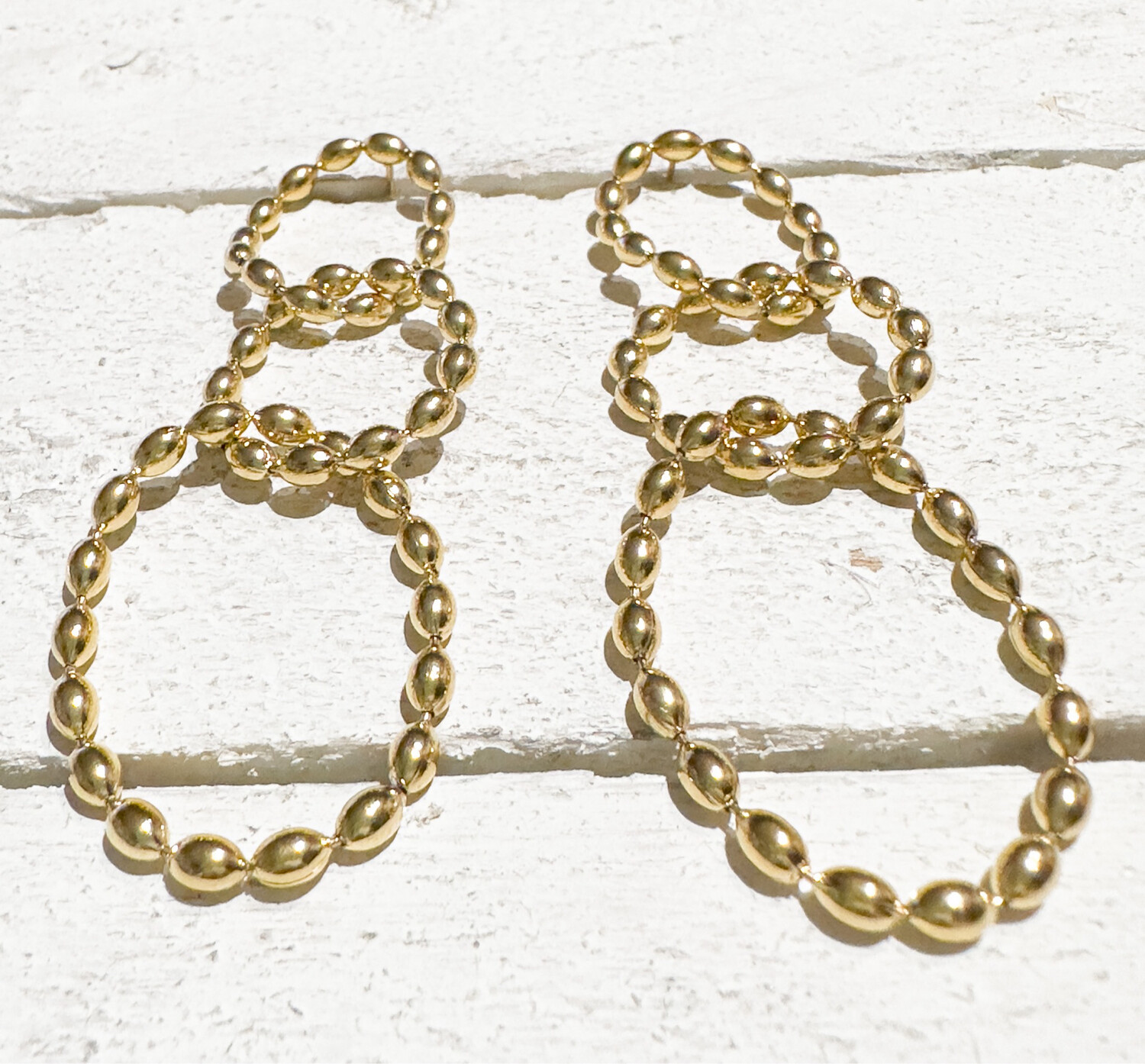 Pendientes acero dorado tres aros bolitas moldeable