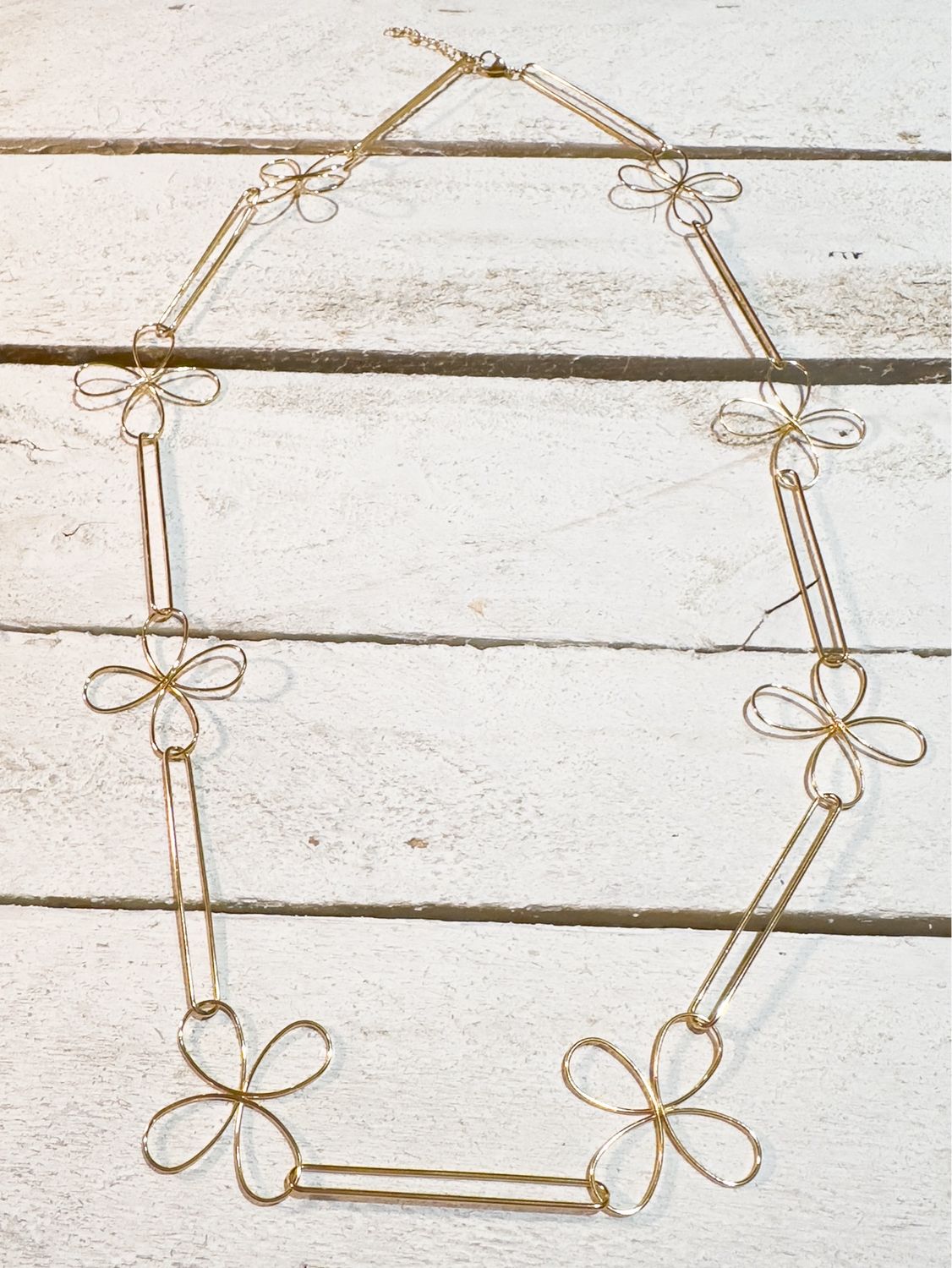 Collar acero dorado silueta flor