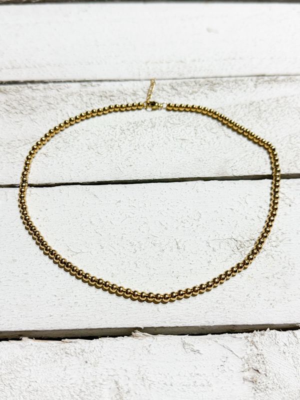 Gargantilla bolitas doradas acero