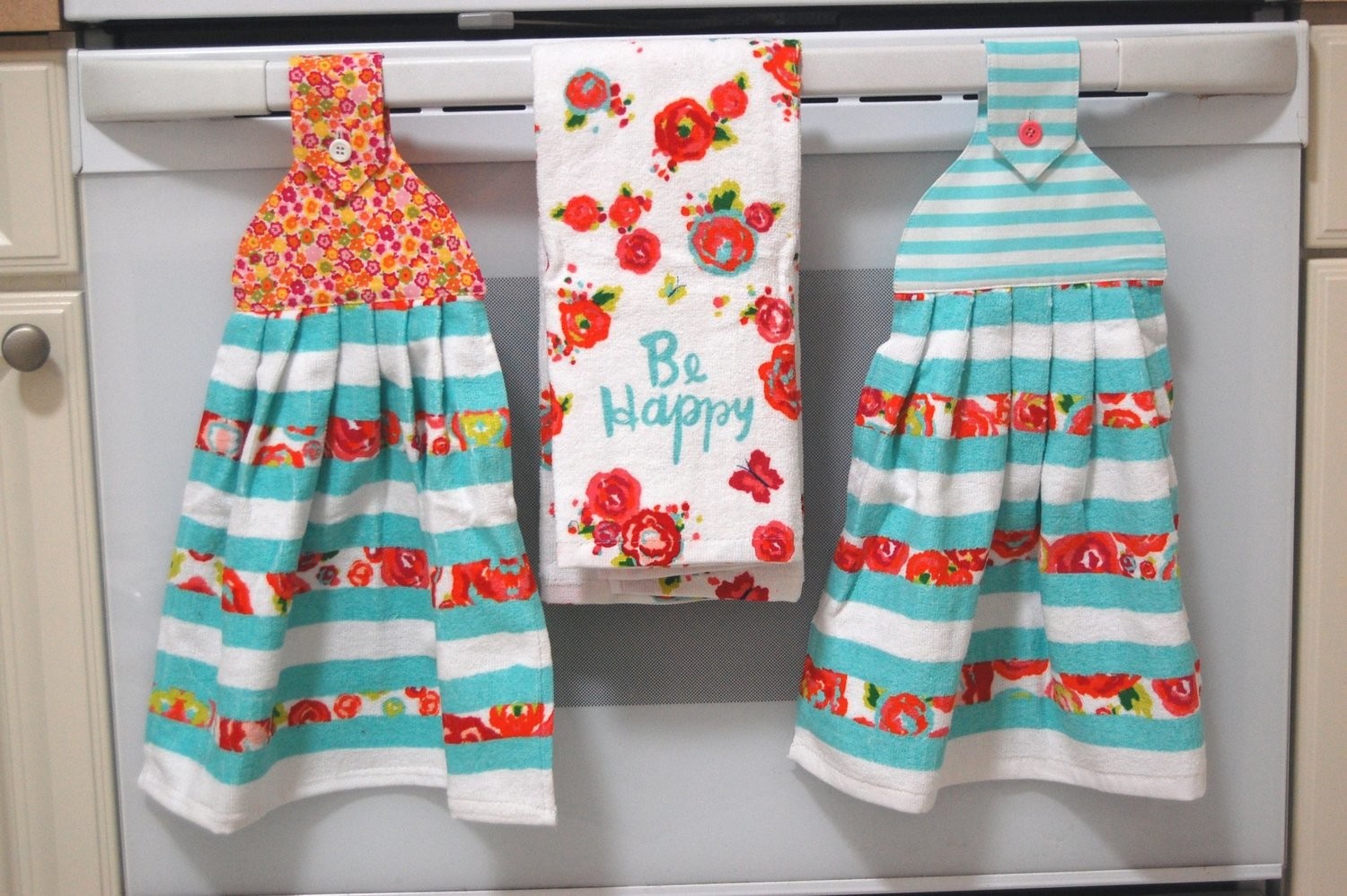 2 beautiful *Be Happy* tie kitchen towel and one Be Happy hand kitchen towel