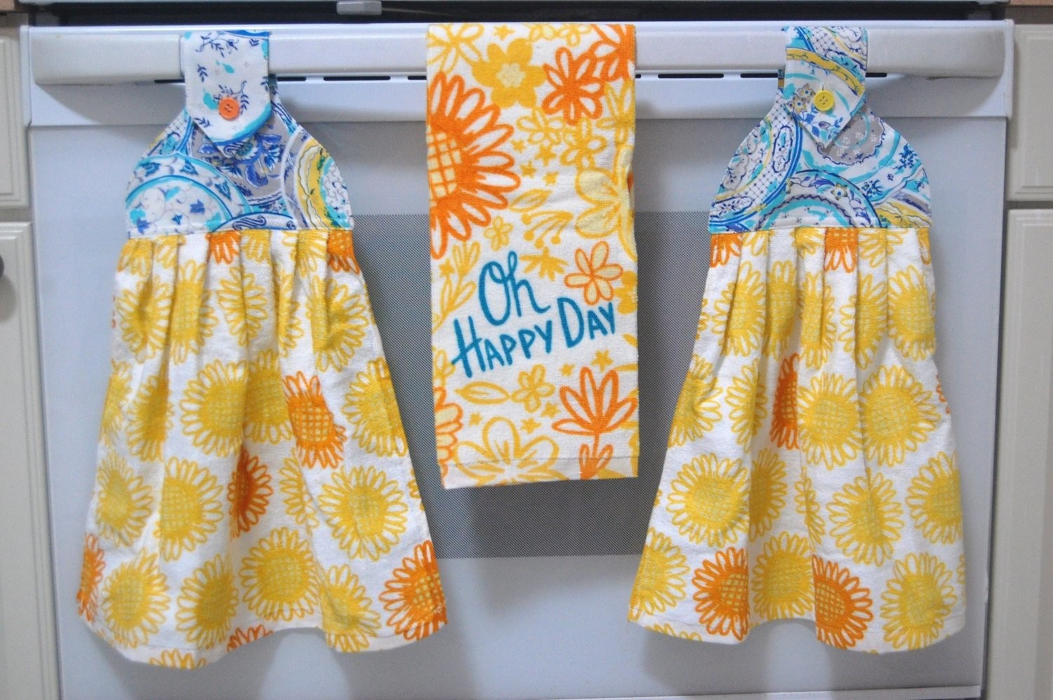 2 beautiful *Oh Happy Day* tie kitchen towel and one hand kitchen towel 2 beautiful *Oh Happy Day* tie kitchen towel and one hand kitchen towel