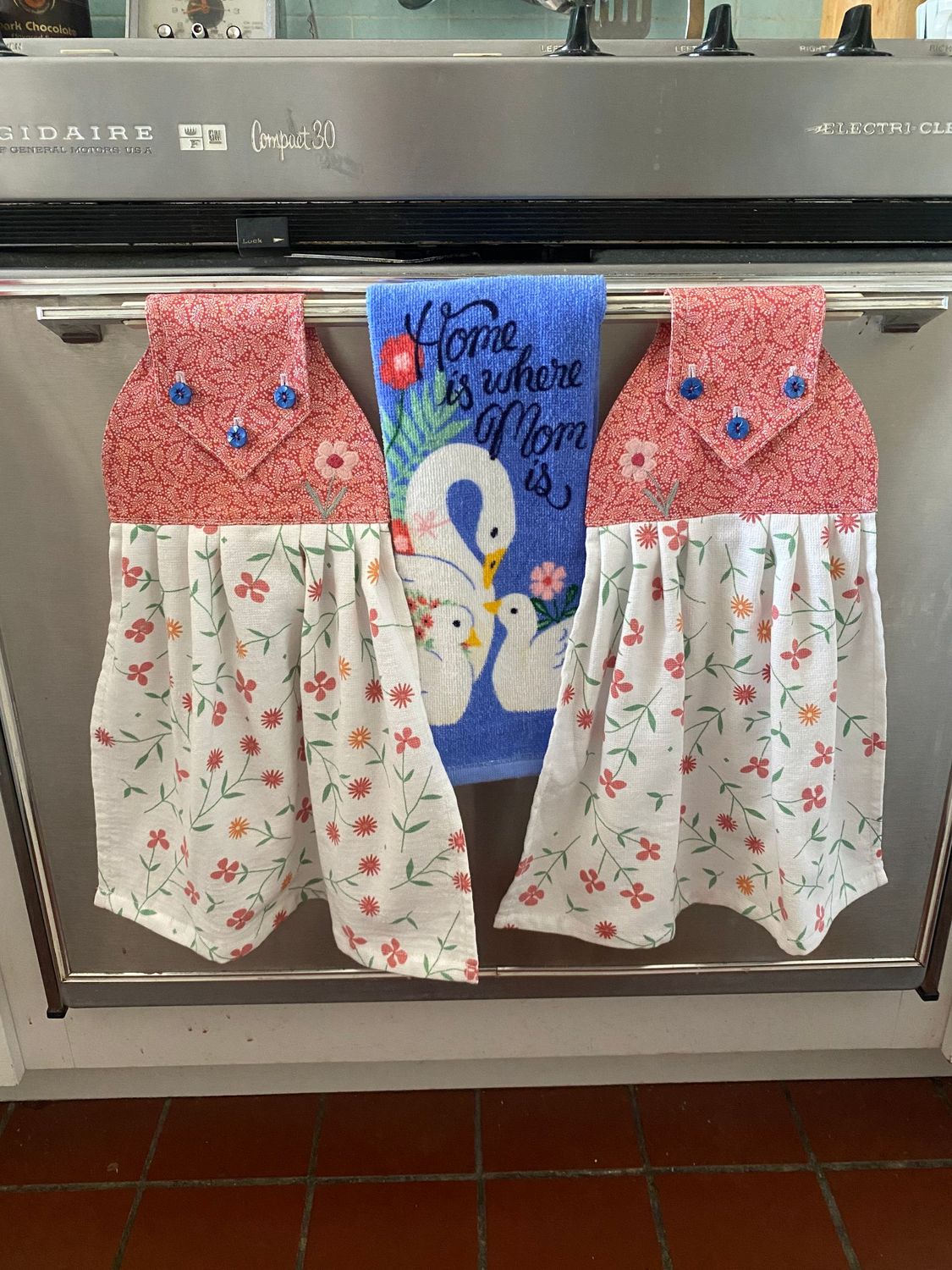 2 beautiful *Home is where Mom is* tie kitchen towels and one hand kitchen towel 2 beautiful *Home is where Mom is* tie kitchen towels and one hand kitchen towel