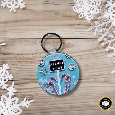 Porte-clés en acrylique de 6 cm de diamètre avec anneau sur le thème des fêtes.