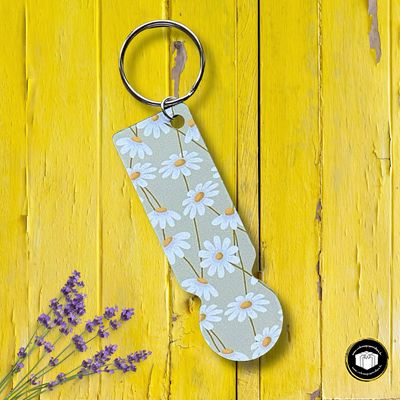 porte-clés pour caddie personnalisé, un cadeau unique avec des paquerettes 