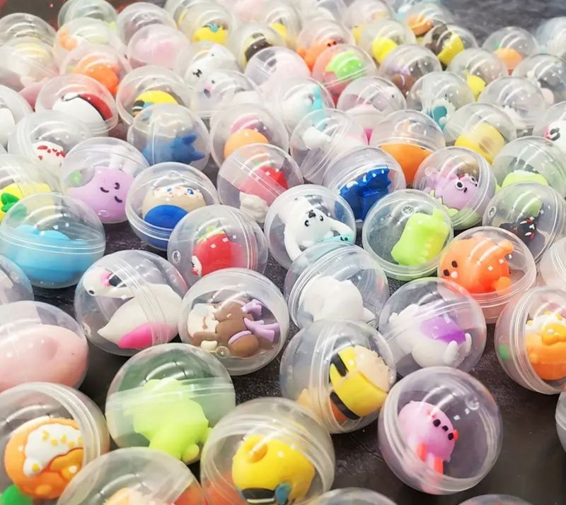 Assorted mini figures in plastic ball
