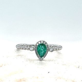 Emerald pear ring with diamonds
