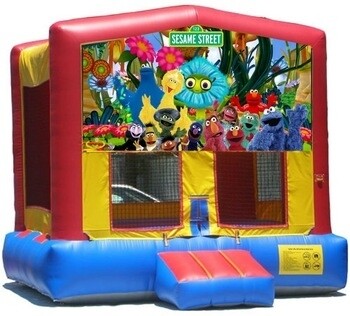 Sesame Street jumping castle with basketball hoop inside.