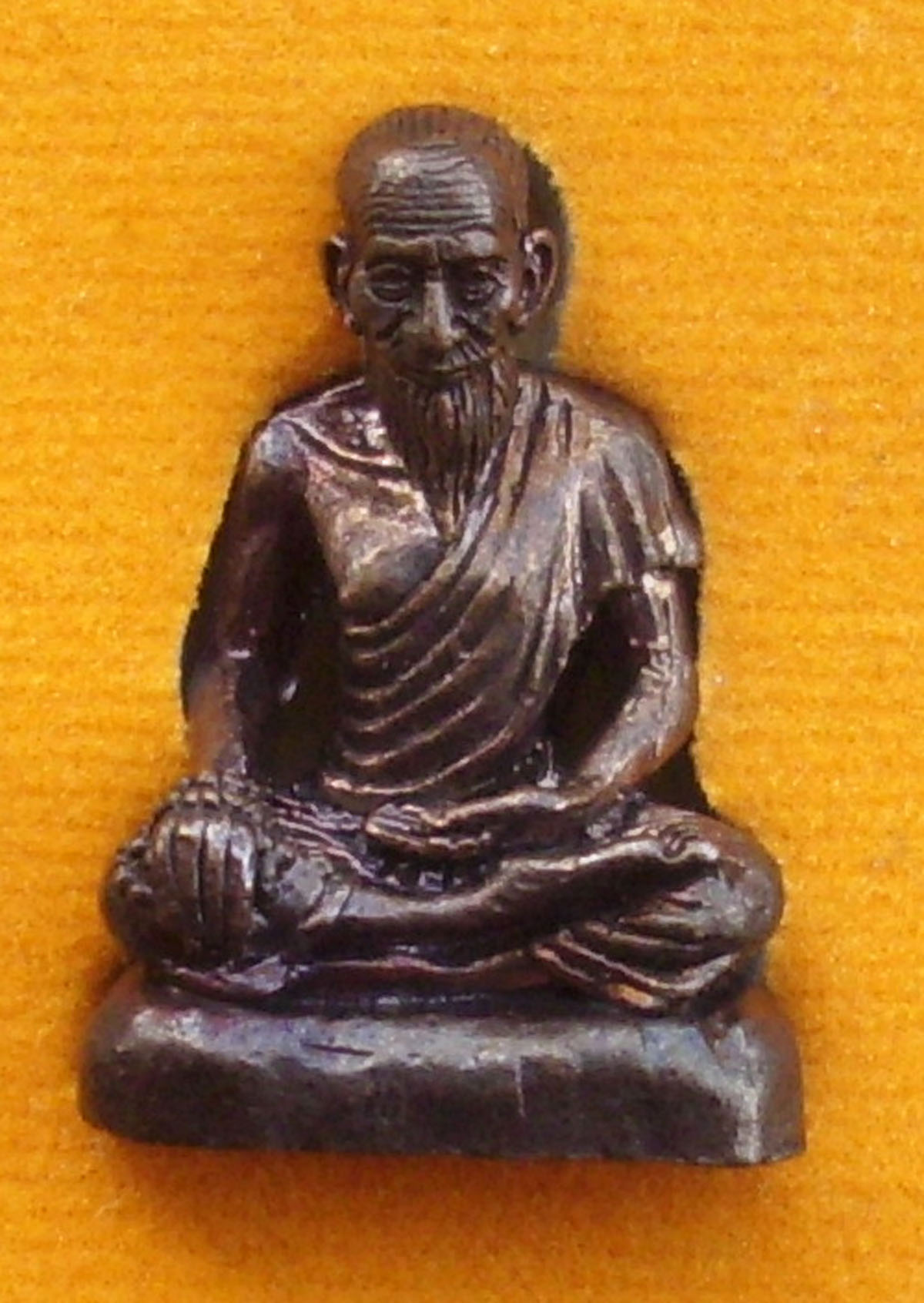 Ruesi Boroma Kroo Chiwok Gomarapaj (Jivaka) Healing Amulet Blessed by Luang Por Jaran (Wat Ampawa) - Nuea Tong Daeng Rom Dam - Hmor Som Hmay Tong Prasert (Doctor Som Hmay) - with or without case