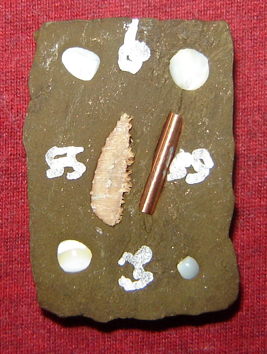 one Takrut and some Muan Sarn of Maha Sanaeh Type is stuffed into the rear face, with sacred Agkhara Kohm Lettering in white 'Bpaeng Sek' (sacred powder paste)