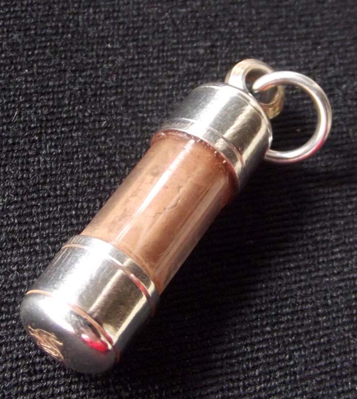 2.5 Cm Long x 1 Cm diameter - the bottom of the Takrut casing has a code stamp embossed.