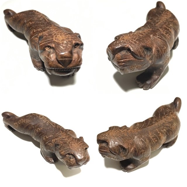 Hand carved Bucha size Tiger with hand iinscxriptions made from Mai Koon, from the Great Luang Phu Bpun Tammabalo of Wat Ban Sangkh in Roi Et.
