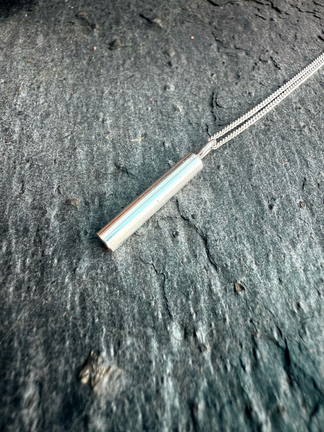 Sounding Pendant: A Minimalist Silver Rod Sounding Pendant: A Minimalist Silver Rod