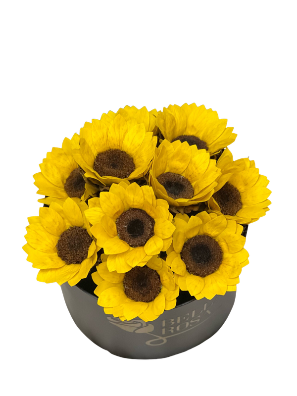 Caja redonda con girasoles preservados