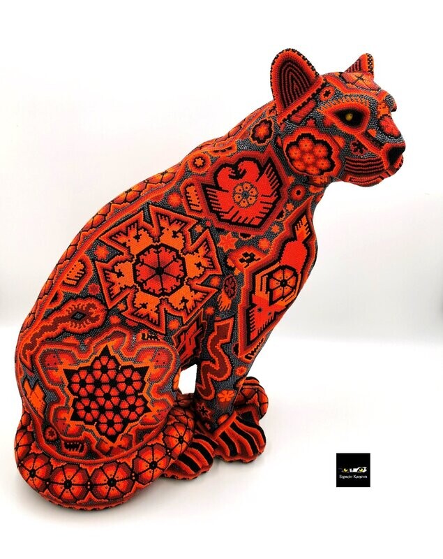 "Red Jaguar figure"