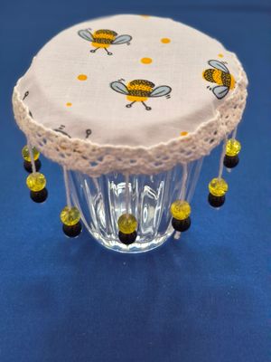 White Bee beaded drinks cover