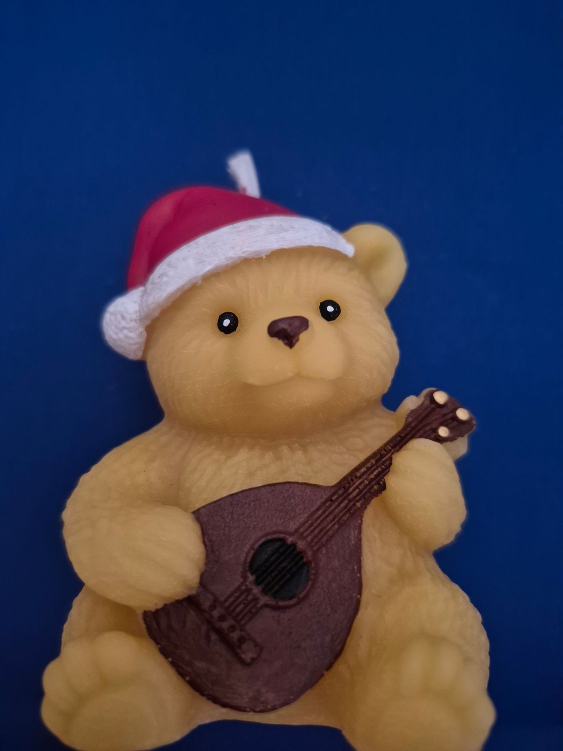 Teddy bear playing guitar