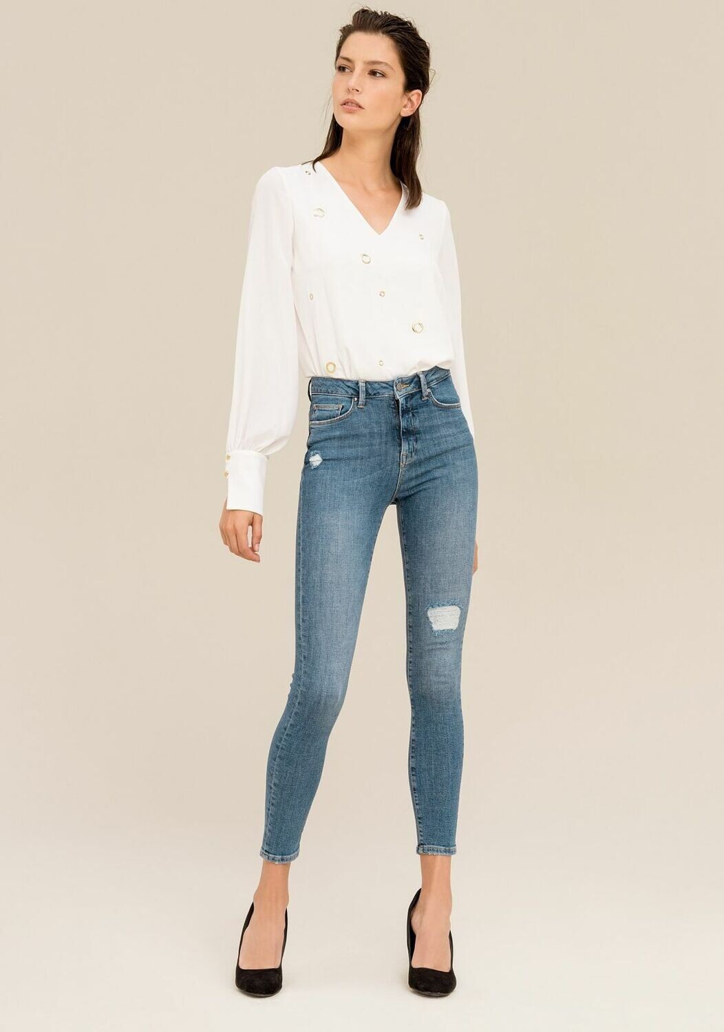 Jeans skinny con abrasioni