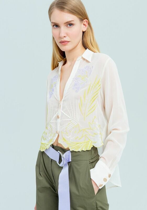 Camicetta asimmetrica con ricami frontali