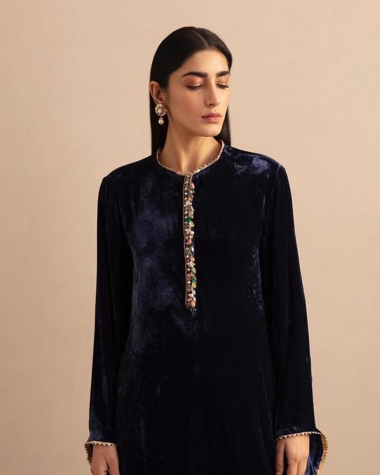 Navy blue silk velvet kurta with jewelled placket detailing paired with embroidered shalwar