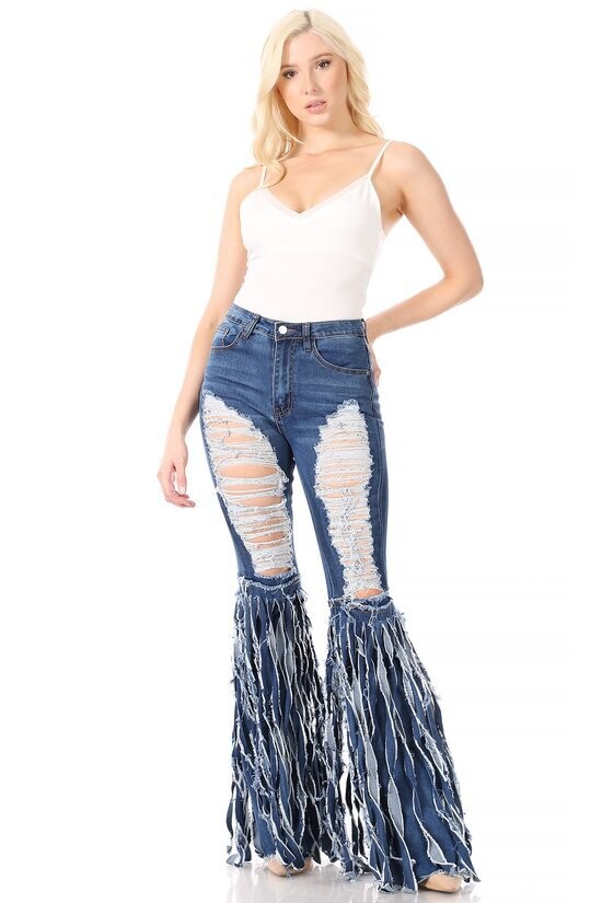 Denim high waisted full length ripped flare jeans with distressed fringe detail.