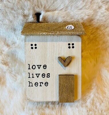 'Love Lives Here' Wooden House