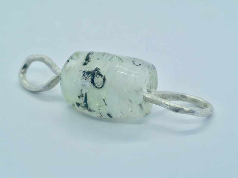 white emubead pendant with metal inclusions