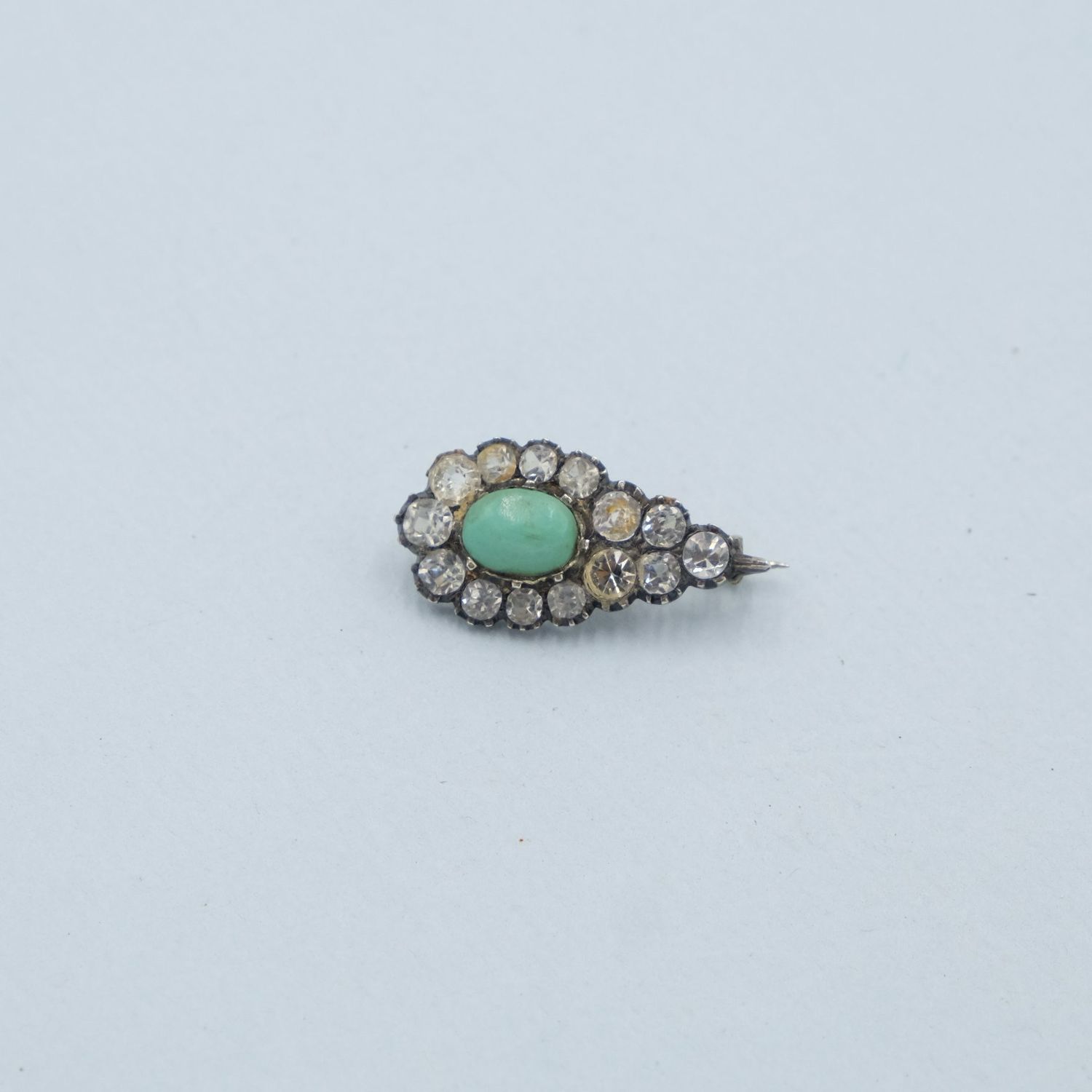 Tiny paste and turquoise glass pin 1890s