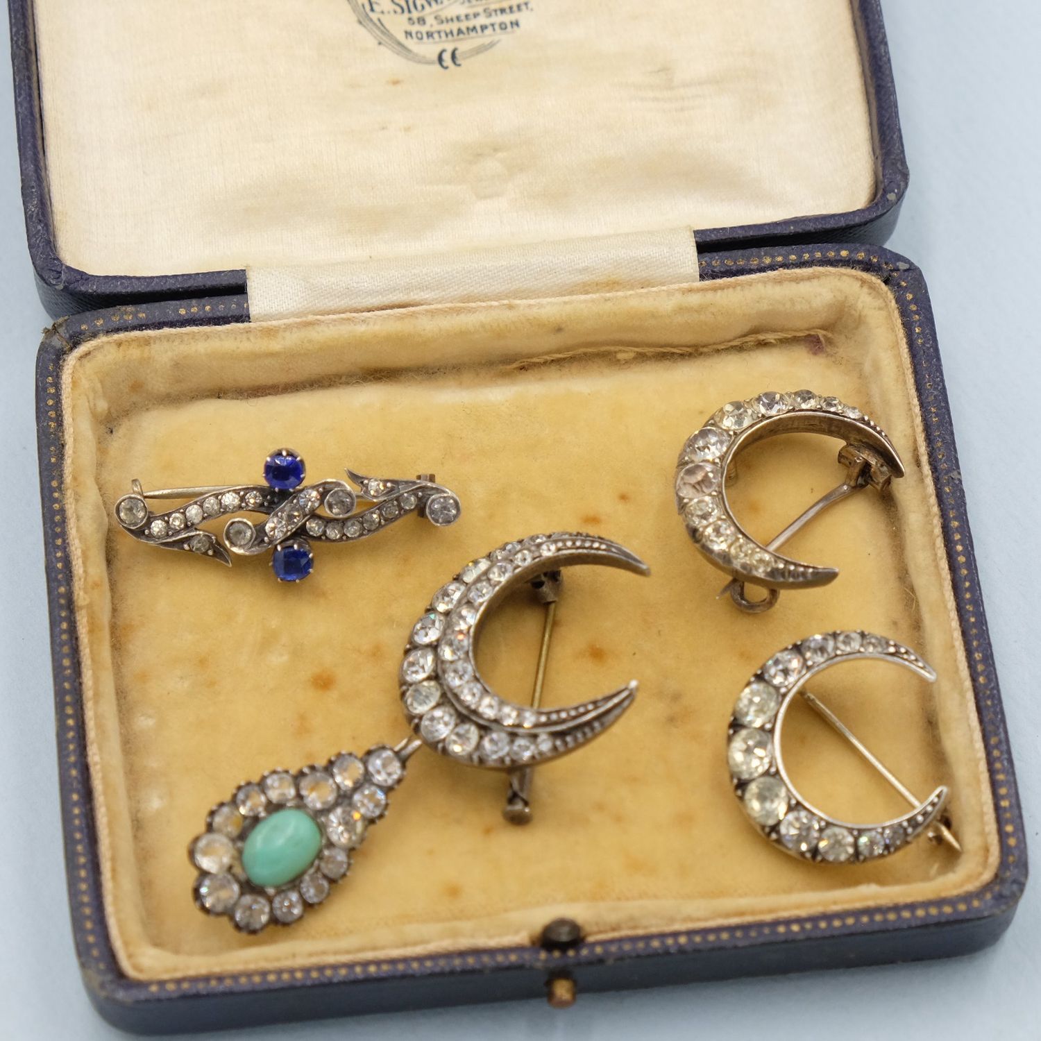 Tiny paste and turquoise glass pin 1890s