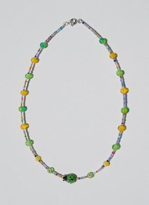 Handstrung Necklace with Glass Beads with Green Ladybug.