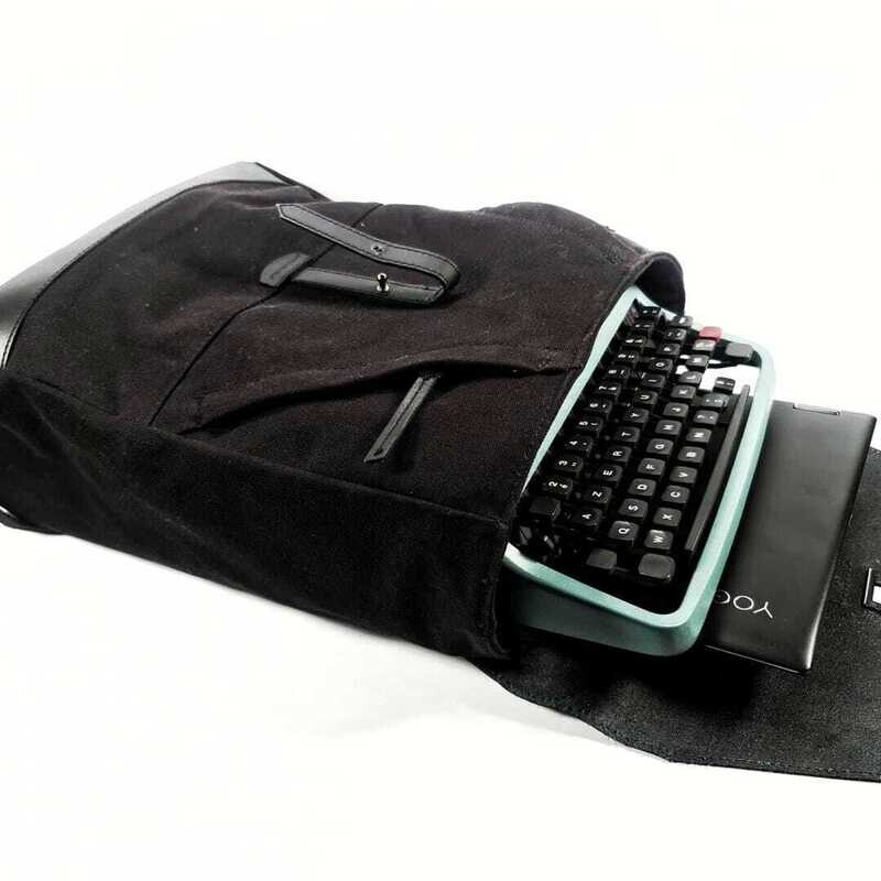 Black backpack for a typewriter and a laptop/tablet