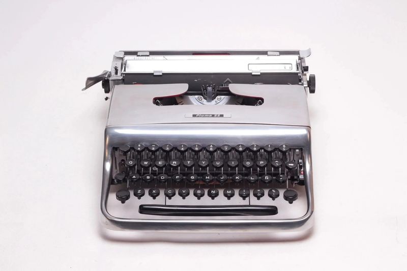 Olivetti Pluma 22, Polished Silver Manual Vintage Typewriter, Restored