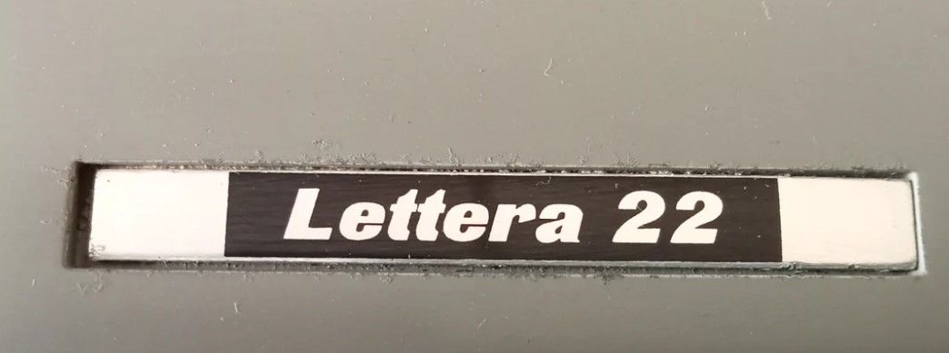 Olivetti Lettera 22 spare parts - a label and a margin release rack