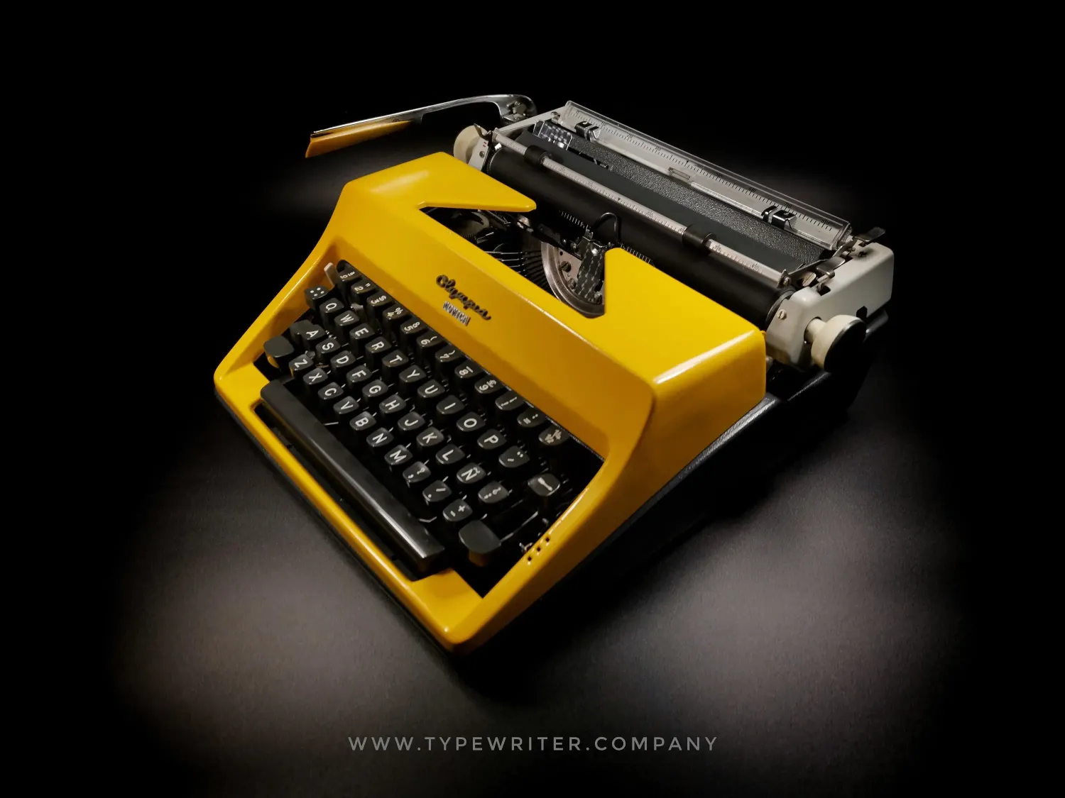 Olympia SM Glossy Yellow Vintage Manual Portable Typewriter, Refurbished