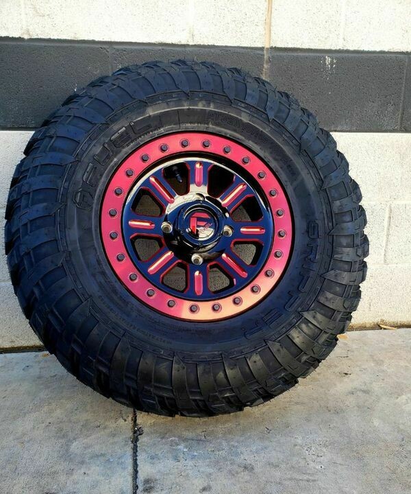 Fuel Hardline D911 15x7 4x136/4x137 38mm Black Milled Red Wheels & EFX Gripper 30x10R15 Dot Tires