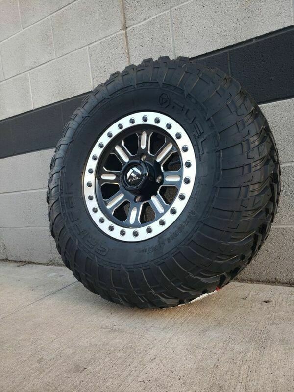 Fuel Hardline D910 15x7 4x137 38mm Gloss Black Milled & EFX Gripper 30x10R15 Dot Tires