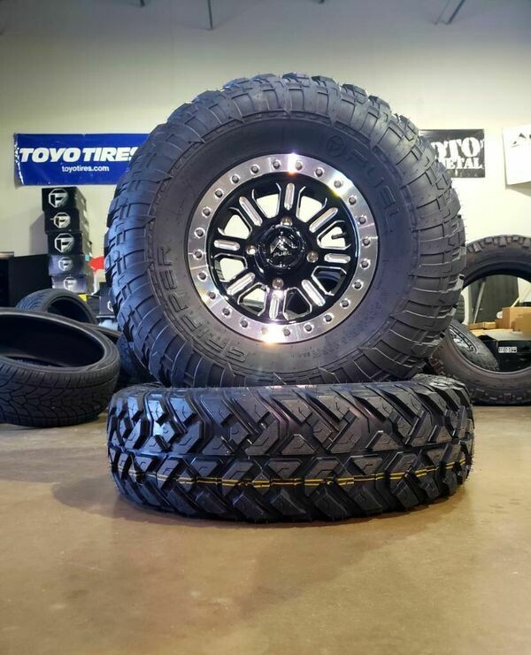 Fuel Hardline D910 15x7 4x156 38mm Gloss Black Milled Wheels & EFX Gripper 32x10R15 Dot Tires