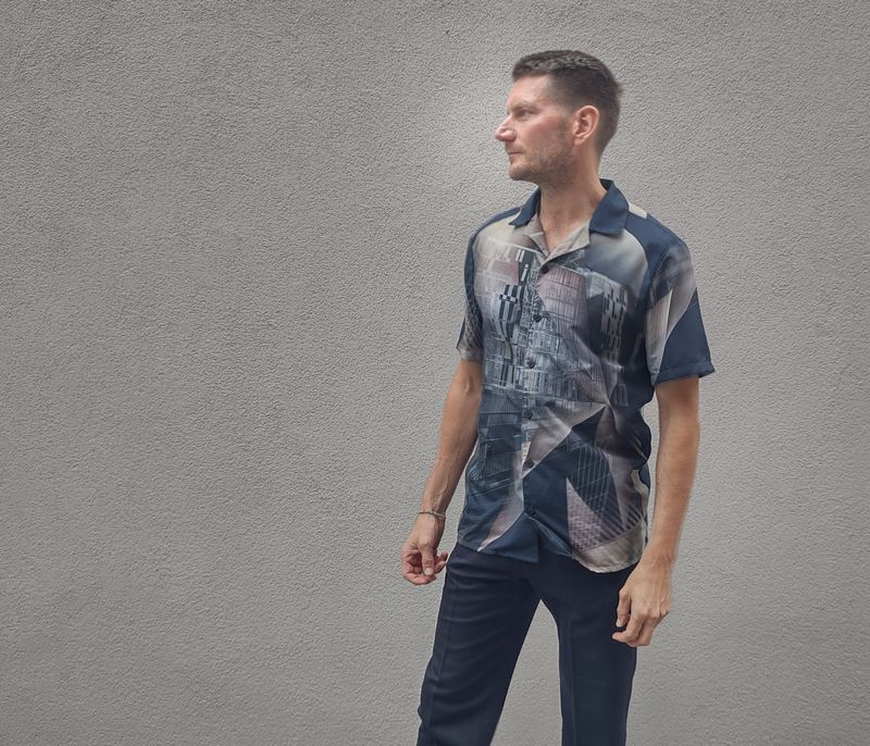 Østerbrogården, unisex button shirt. Make sure when ordering this shirt 2 sizes smaller than normal as it is oversized.
