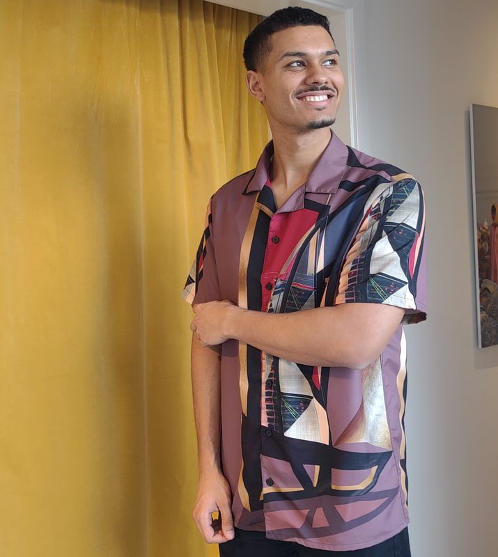 Burj al Arab, unisex button shirt.  Make sure when ordering this shirt 2 sizes smaller than normal as it is oversized.